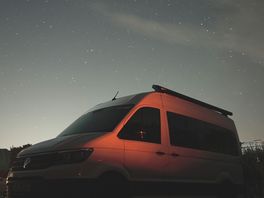 Night sky with the camper van and fire pit
