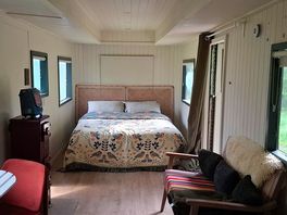 Zeus shepherd's hut king size bed in sleeping area