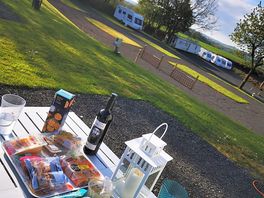 What more do you need... food, drink, music, sunshine, great views, great site and great company