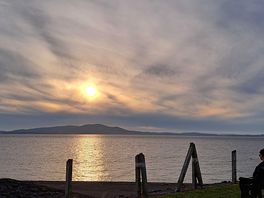 Beautiful sunset over the water and mountains