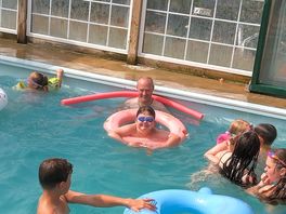 Swimming pool with roof retracted