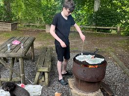 Grandson cooking dinner