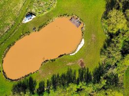 Birds eye view of the lake and hut.