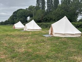 Unfurnished bell tents so guests can decorate