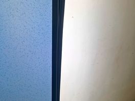 Toilet door hinged with gaffer tape