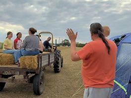 Waving the children off on their tractor ride