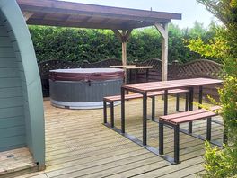 Pod with outdoor seating and hot tub
