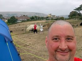 Tent pitched near the pig field at the bottom of the field near the showers and toilets