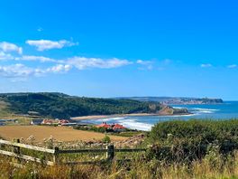 View down to the beach from the site