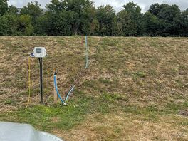 Water pipe just on top of the bank