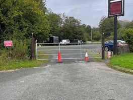 View of the carpark / hard standing. gate is closed at night.