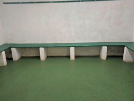 Men's changing room where men can compare their manhood together.