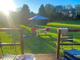 View from the pod. bistro set on porch plus a large picnic bench with parasol, fire pit and bbq inc.
