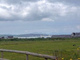 View from the pitched area over the bay with snowdonia in the background