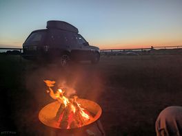 Watching the sunset by the fire