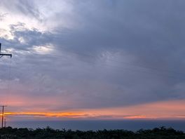 Sunset peeking through the clouds.