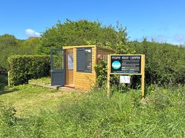 The welcome hut with a fridges, a freezer and a kettle
