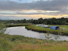 View of the fishing lake, it has benches along the side to sit on aswell.
