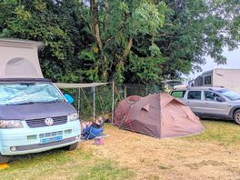 Our campervan and tent in the shade on a very hot day in august.