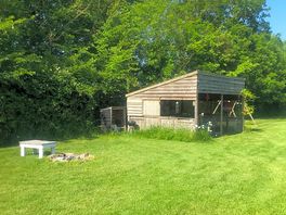 Fully equipped outside kitchen and fire pit area.