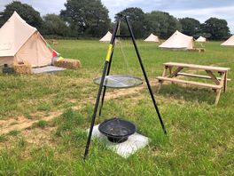 A typical pitch includes a table, your tent and a fire pit or bbq tripod