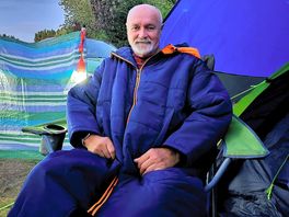 Sat outside tent