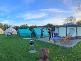 Kestrel yurt with cooking tent and bathroom on the right, other 2 glamping tents on the left.