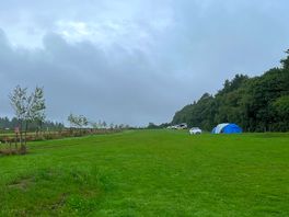 The site with pitches down the right hand side. there were some picnic benches opposite.