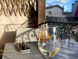 A glass of wine in the local village square