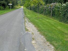 The quiet road outside the site.