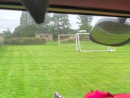 Lovely flat sheltered lawn with moveable goalposts!