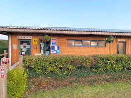 Reception/shop and bathroom block with added washing up facilities and laundry area