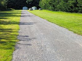 Bottom of the hill by the loos