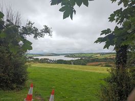 View over the nearby hills and river from the bottom of the site.