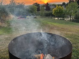 Keeping warm by the complimentary fire pit.