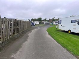 In front on the fence