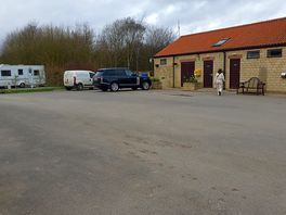 Shop/reception/ttoilets. to the far side, waste bins and locked family bathroom/family showers