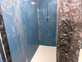 No door on shower or curtains on any showers