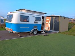 Large pitch with tarmac hard standing, astro turf for an awning, and a huge natural grass area.