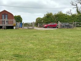 Entrance onto the campsite with the arch accommodation