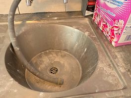 Sink being used as the drain from the washing machine.