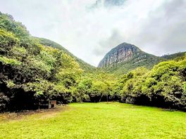 Grassy pitches with mountain views
