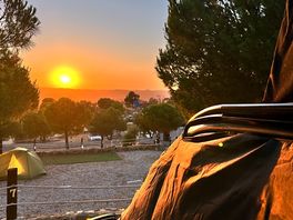 View of the sunset over the mountains from my pitch