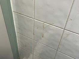 Dirty wall in cubicle