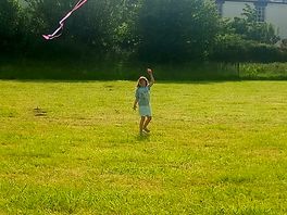 Daughter playing with a kite