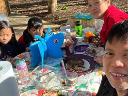 Family enjoy eating breakfast