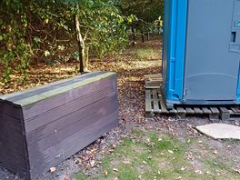 Wooden unit could be useful possibly but not as it situated right next to the toilet