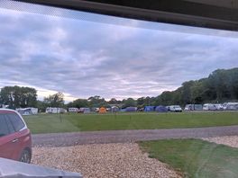View from our caravan to the back of the site with many tents