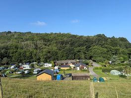 View across showers, shop, loos and laundry