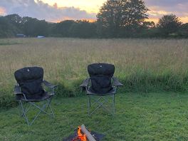 Getting the fire going as the sun goes down.